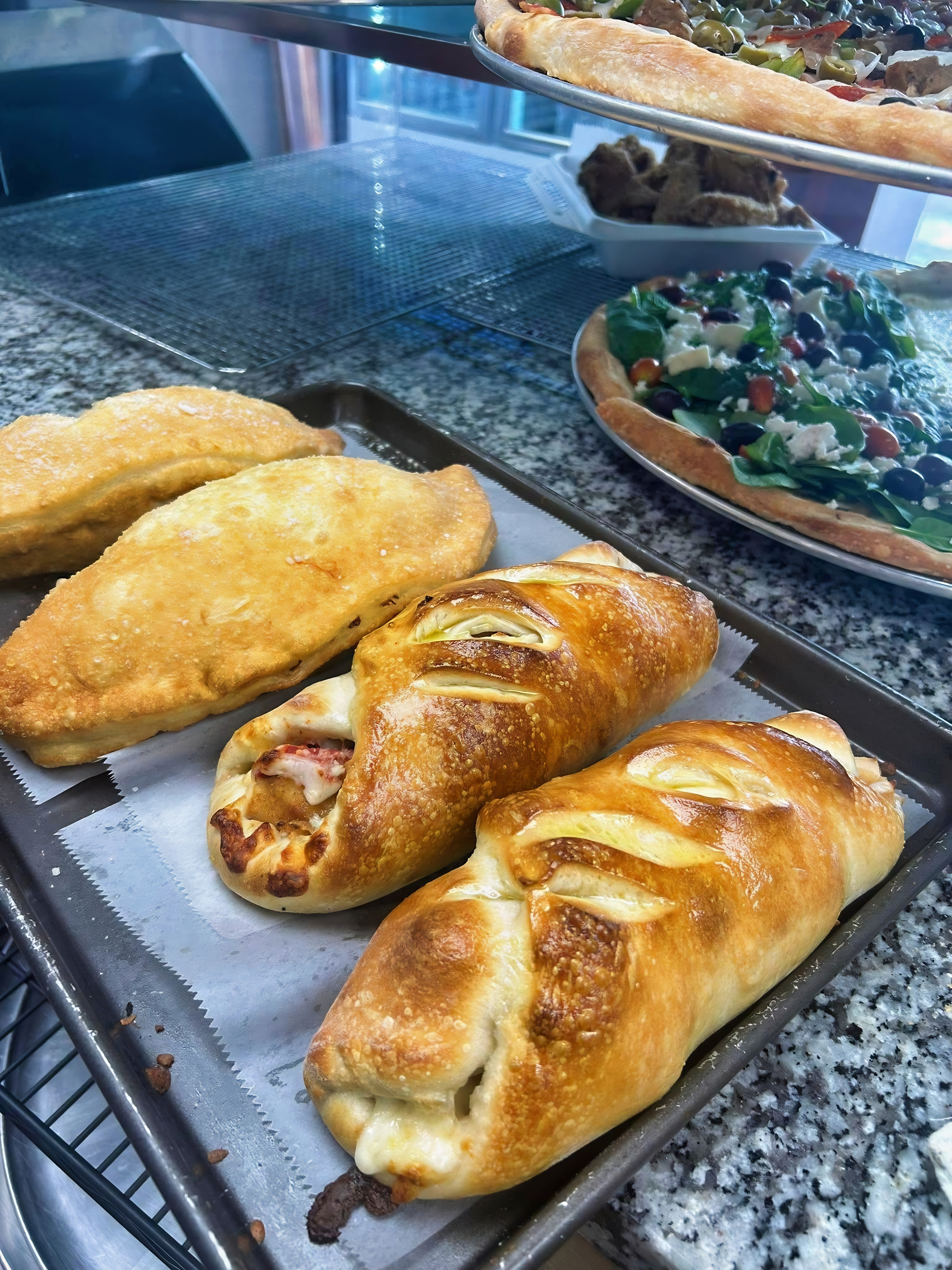 Chicken and pepperoni rolls at Mario's Pizza by the Slice
