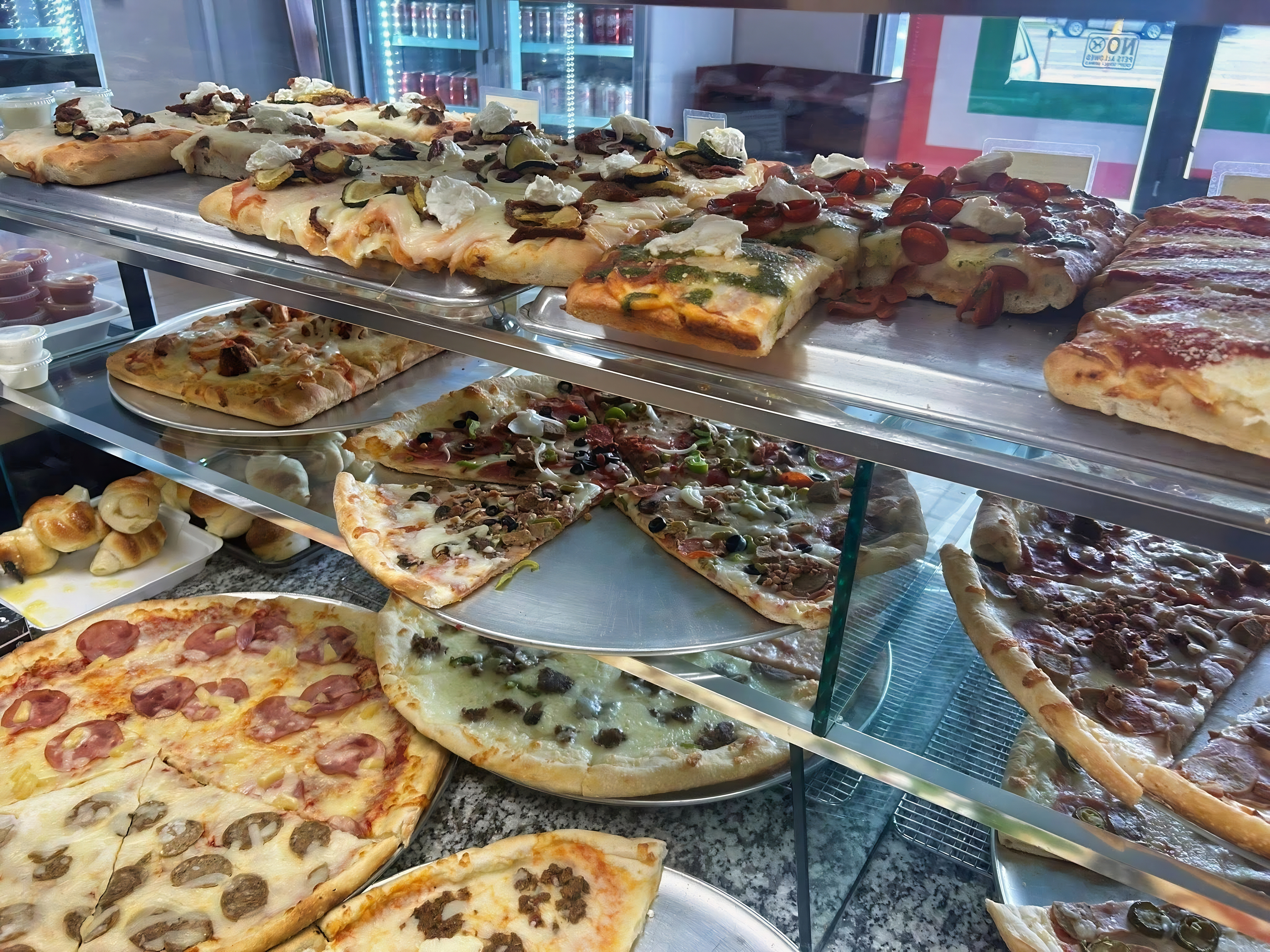 Pizza display case at Mario's Pizza by the Slice in Wichita Falls